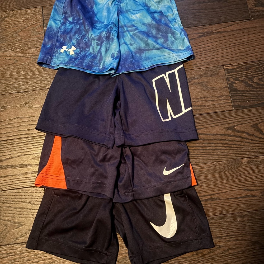 4 Pairs of Nike and Under Armour Kids Shorts